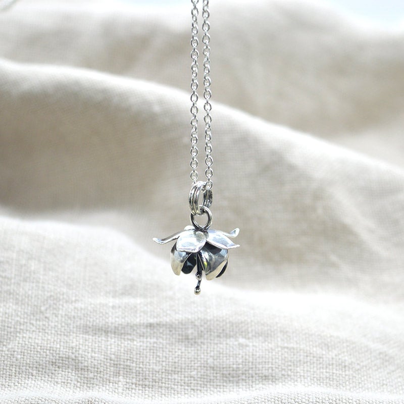 Silver flower store pendant